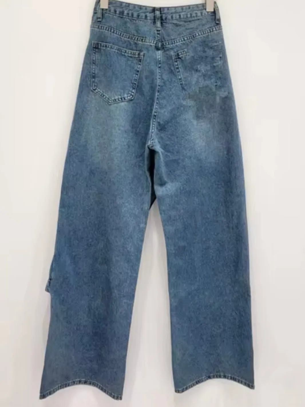 Blue washed crossed front asymmetrical jeans pants